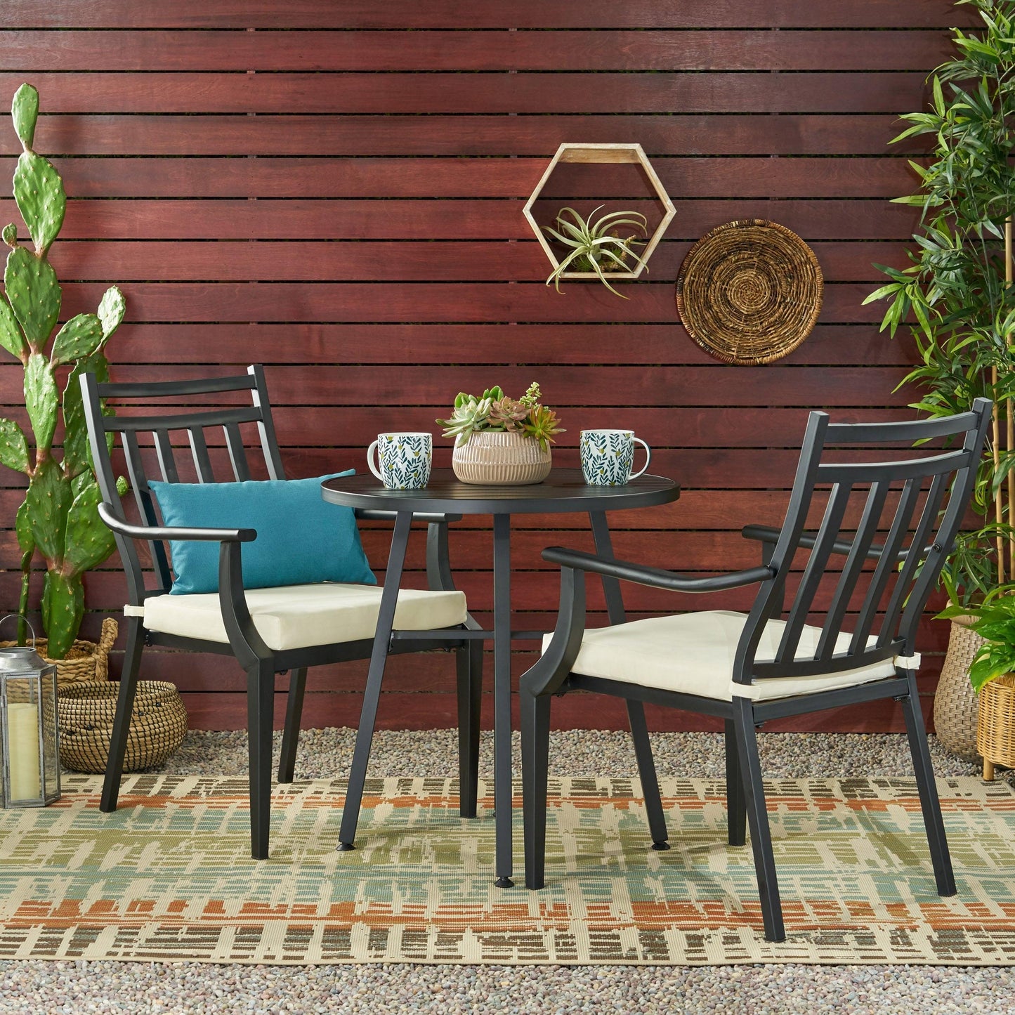 Elegant metal bistro table and chairs set, perfect for stylish outdoor dining spaces