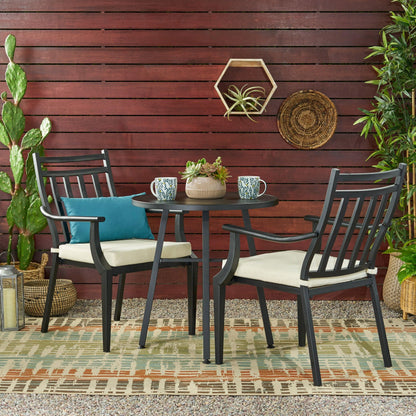Elegant metal bistro table and chairs set, perfect for stylish outdoor dining spaces