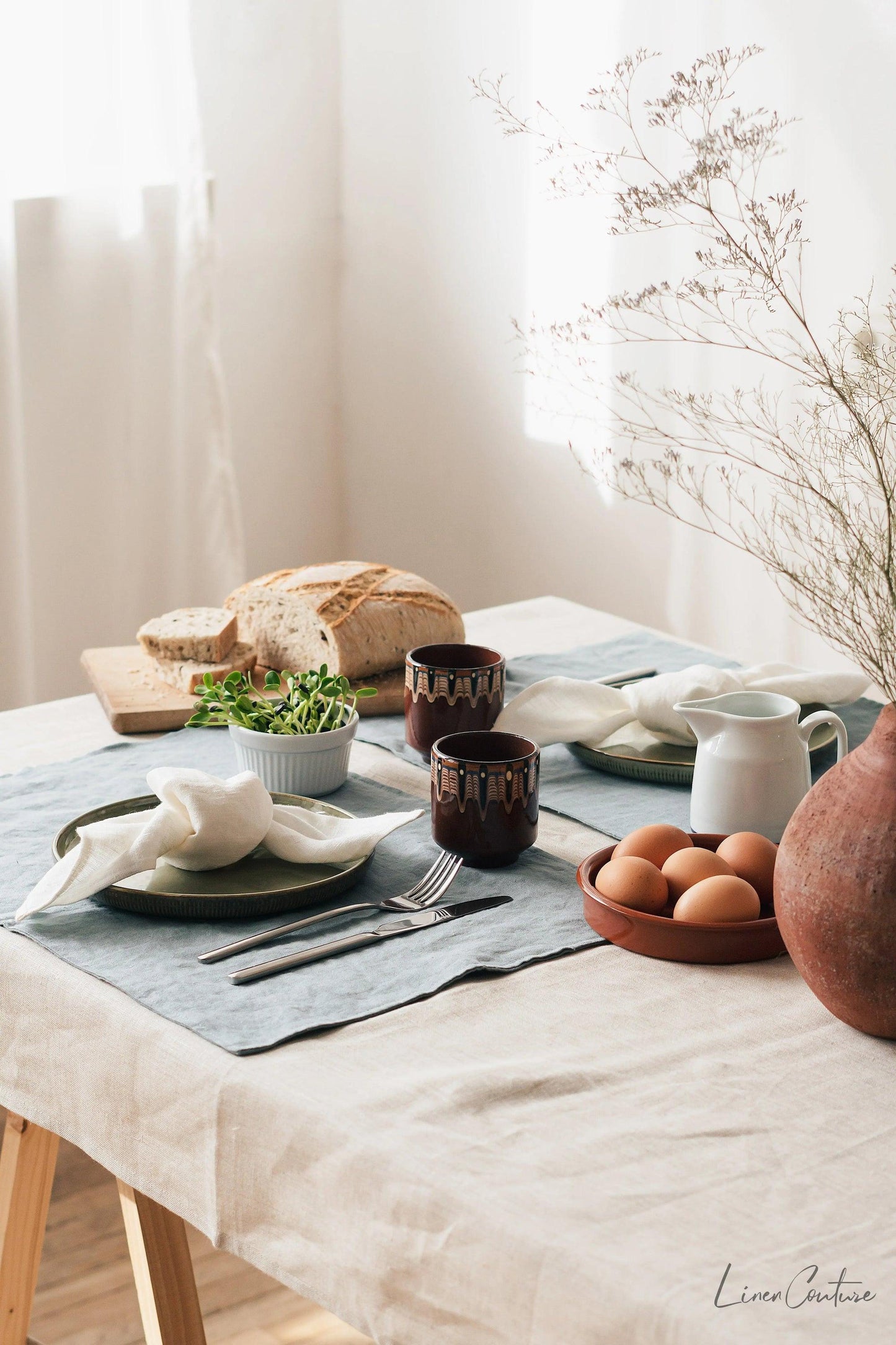 Elegant natural linen napkins arranged neatly on a dining table enhancing eco-friendly decor