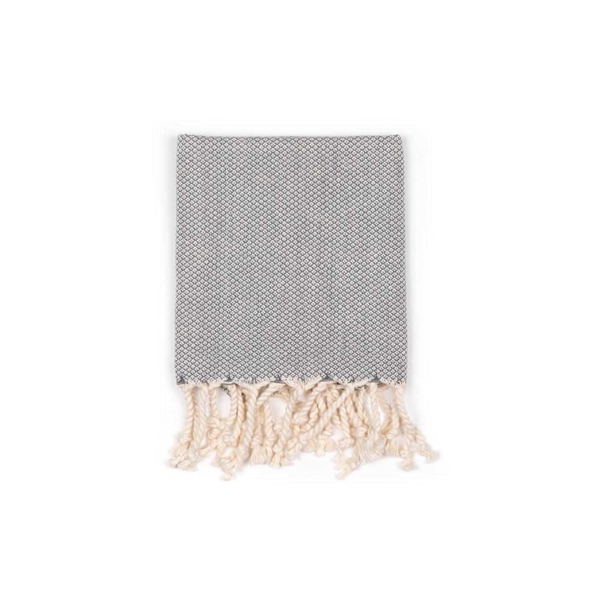 Elegant handwoven table linen set showcasing intricate craftsmanship and premium fabric for sophisticated dining decor.