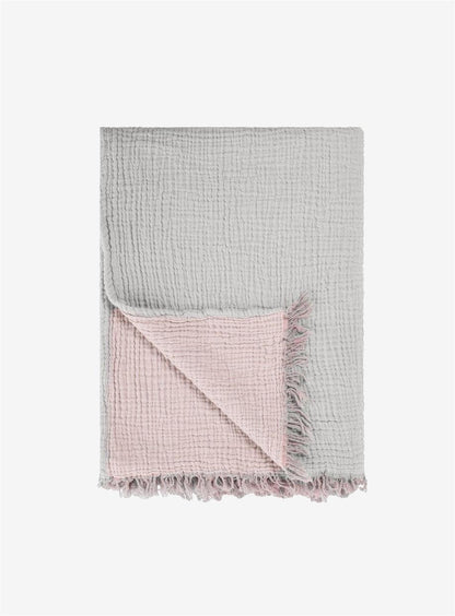 Cozy cotton throw blanket providing warmth and comfort for home and living spaces