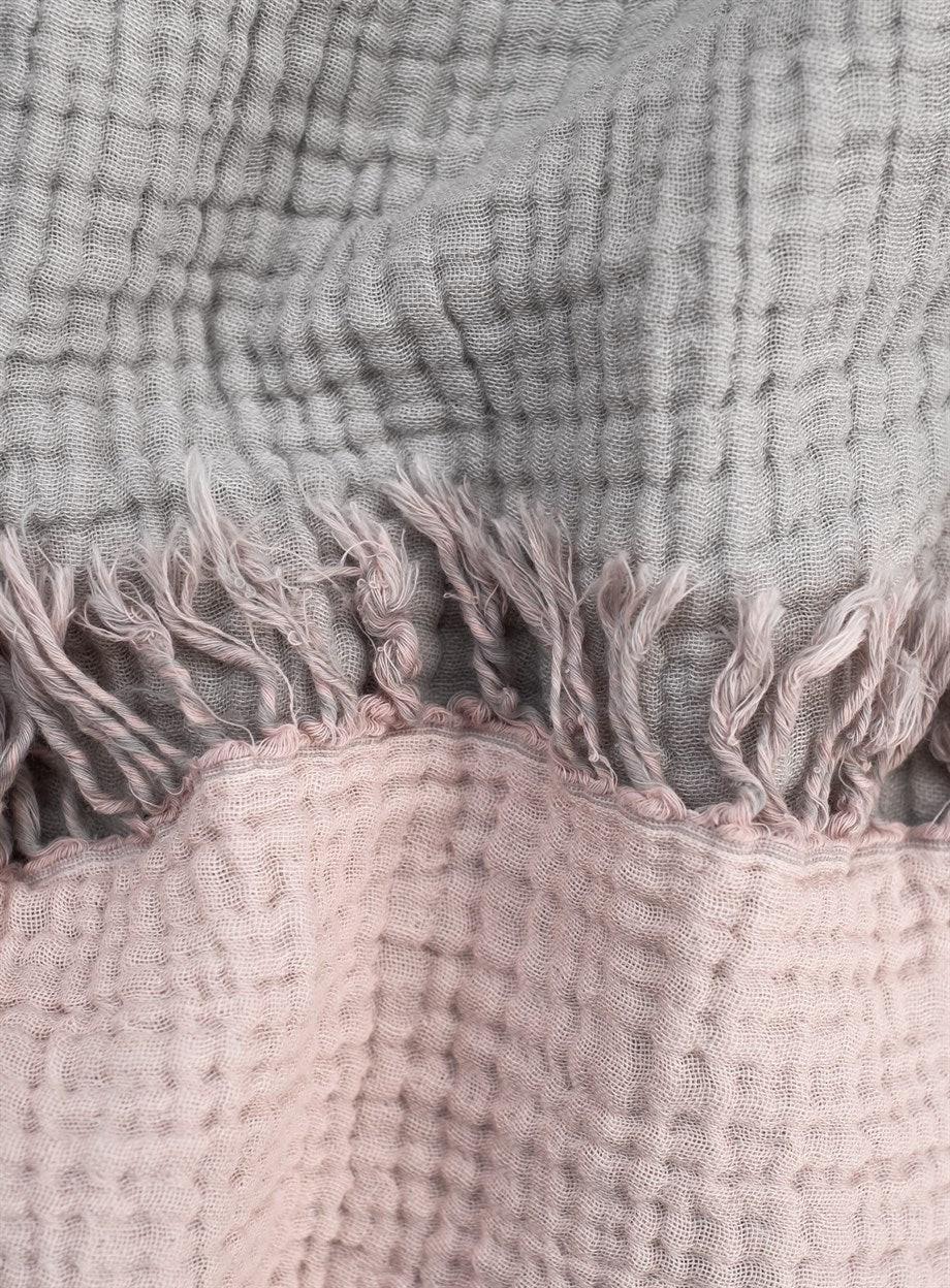 Cozy cotton throw blanket providing warmth and comfort for home and living spaces