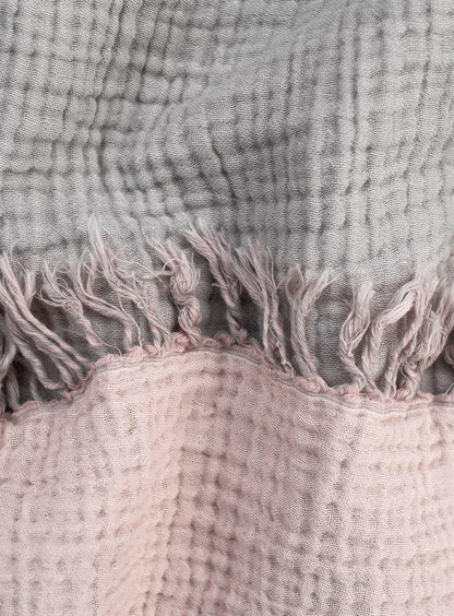 Cozy cotton throw blanket providing warmth and comfort for home and living spaces