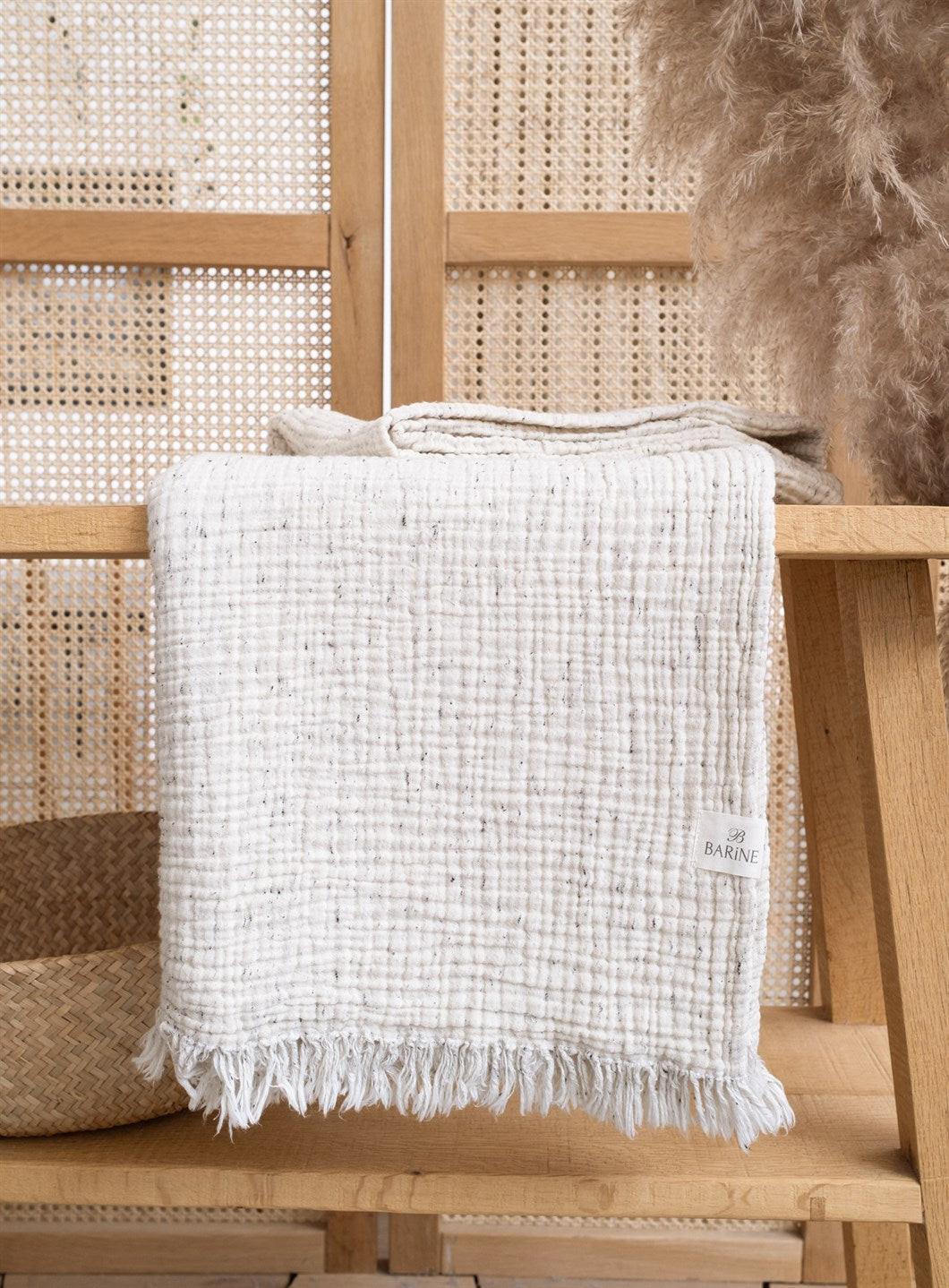 Cozy cotton throw blanket providing warmth and comfort for home and living spaces