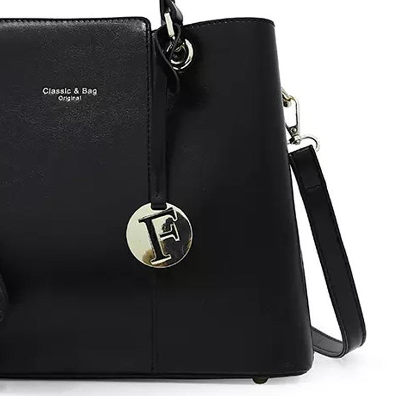 Elegant faux leather handbag with sophisticated design, perfect for formal occasions and stylish everyday use.