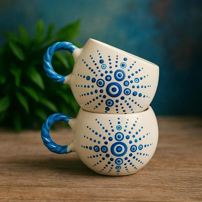 Handmade ceramic mugs showcasing fine craftsmanship and unique design, perfect for elegant home decor.